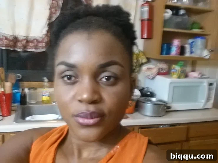 Woman looking tired after a cooking show, in a messy kitchen