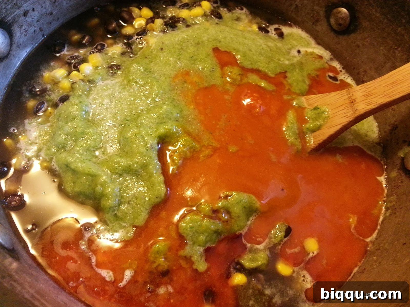 Adding palm oil and seasonings to Corn Chaff