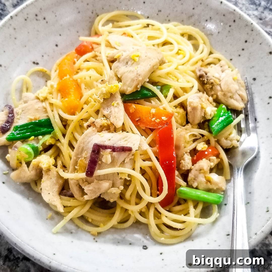 spaghetti stir fry on a plate