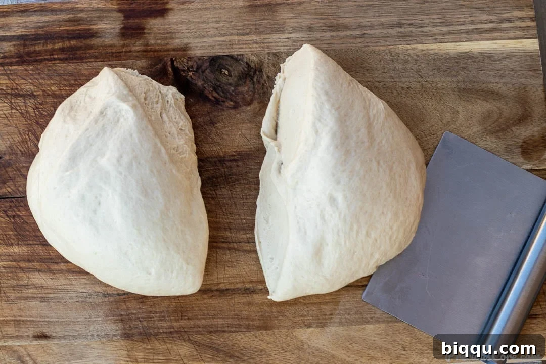 Perfect Everyday Sandwich Bread 7 2 portions of dough on a chopping board.