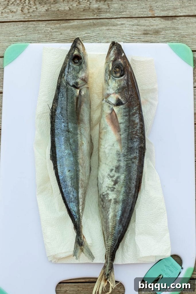2 whole fish on cutting board