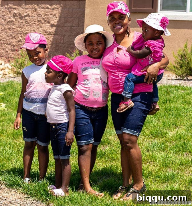 Loving Your Children Deeply 2 A loving mother embraces her four daughters, embodying the warmth of family connection and presence.