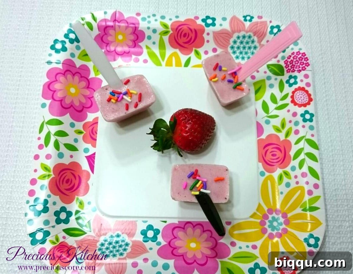 Fresh strawberries, yogurt, skim milk, and honey ingredients for popsicles