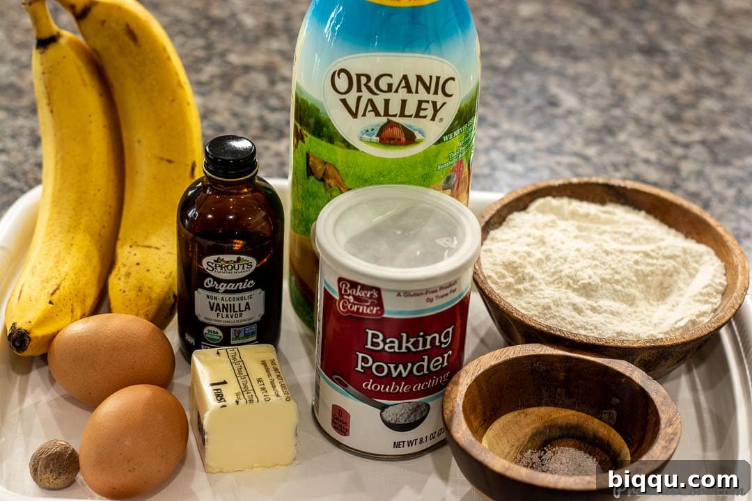 Photo of all ingredients for delicious banana pancakes laid out on a kitchen counter
