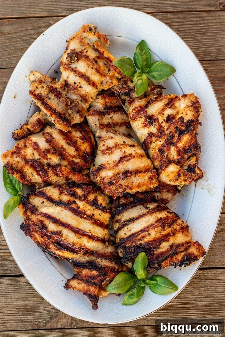 Succulent Grilled Boneless Chicken Thighs 2 Platter of perfectly grilled boneless chicken thighs with char marks