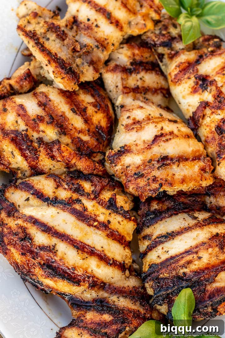 Succulent Grilled Boneless Chicken Thighs 3 Close up view of perfectly grilled chicken thighs showcasing beautiful char marks