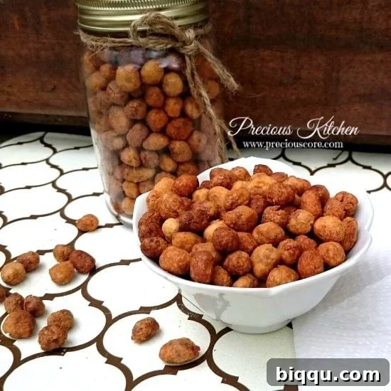 Close-up of golden brown Peanut Burger Snacks scattered on a surface, highlighting their irregular, coated shape.