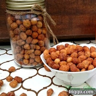 Freshly coated raw peanuts ready for frying, showing the flour and egg mixture adhering to the nuts.