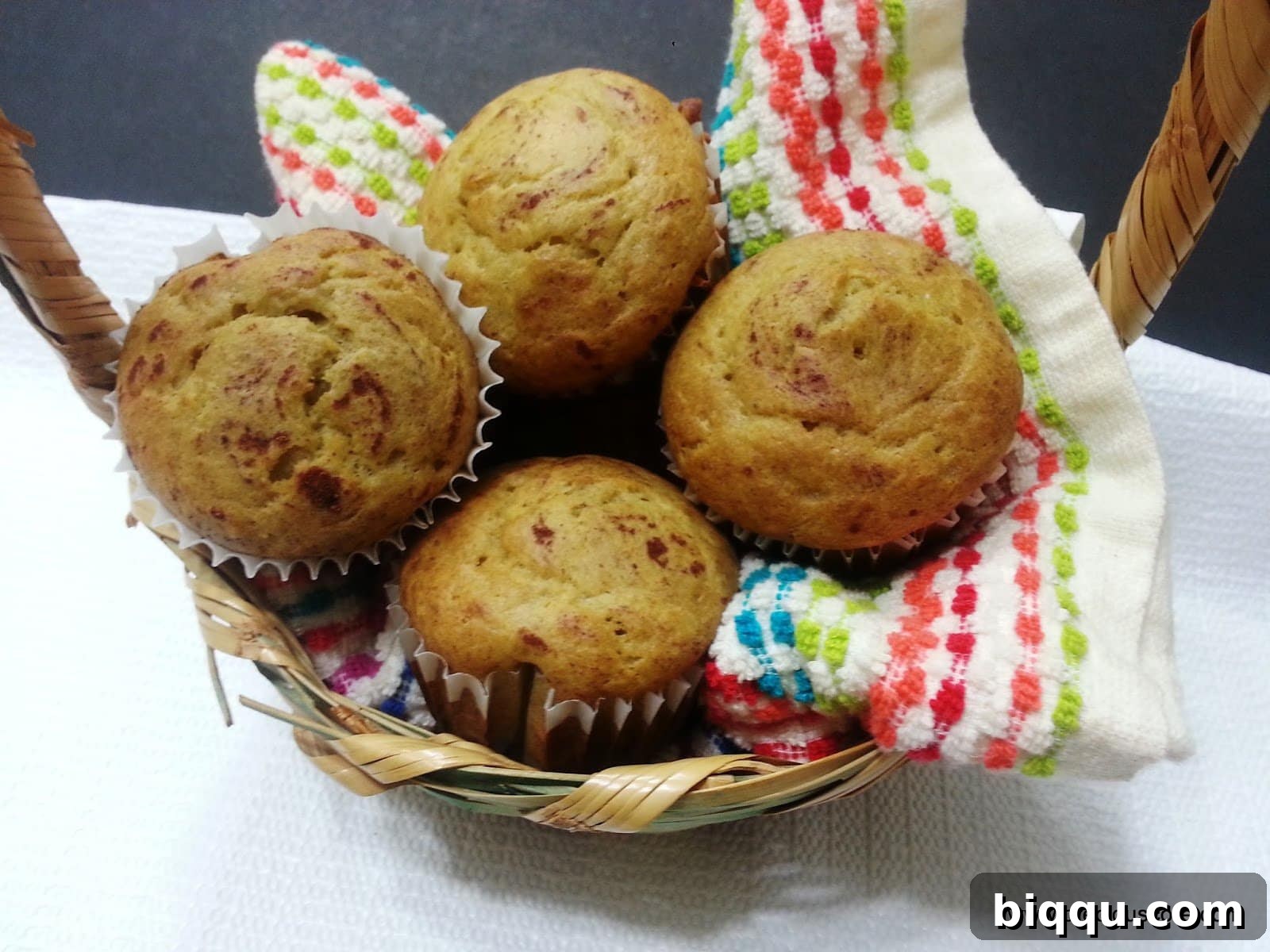 Cameroon banana cakes on a washcloth in a basket.