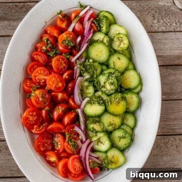 tomato cucumber salad on a platter