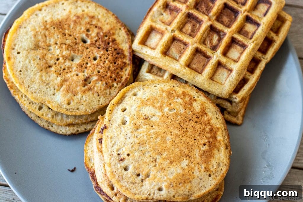 A delightful serving plate featuring both golden plantain pancakes and perfectly browned plantain waffles, offering a delicious choice.