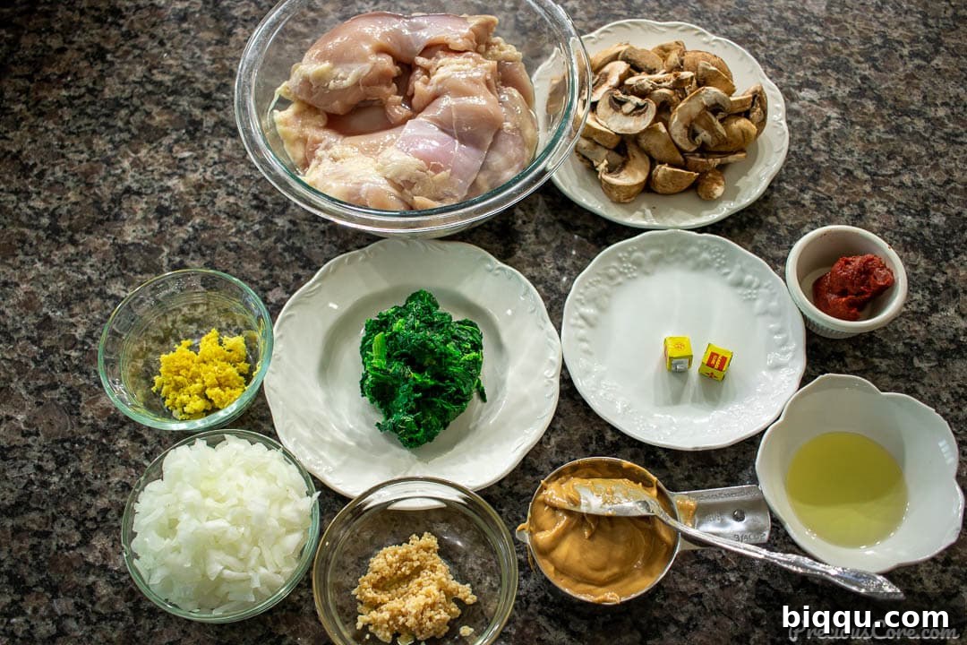 Ingredients needed for easy African chicken peanut stew laid out on a countertop.