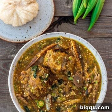 A bowl of African Okra Soup with a plate of Garri fufuf on the side