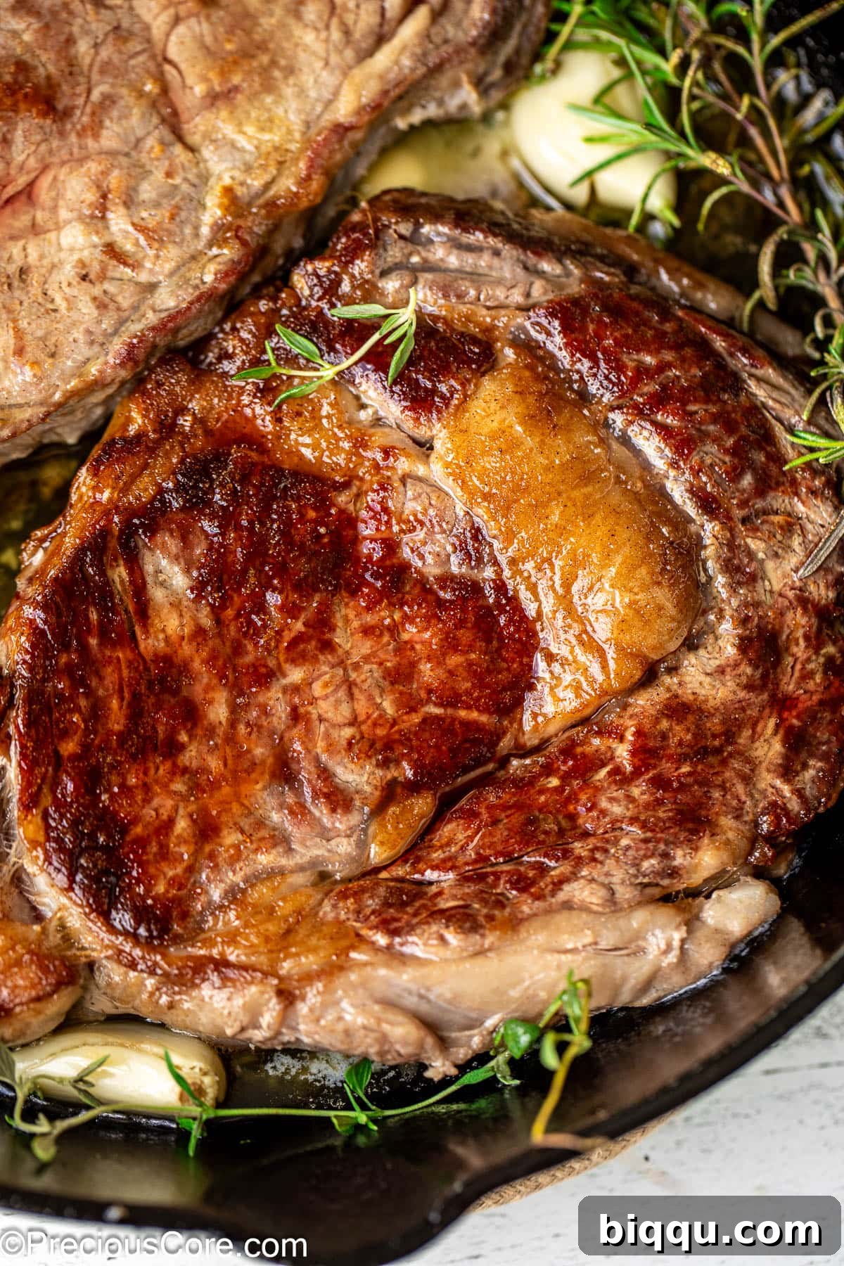Seared Ribeye Perfection 9 Another close-up of a pan-seared ribeye steak, highlighting the rich fat marbling and inviting crust.