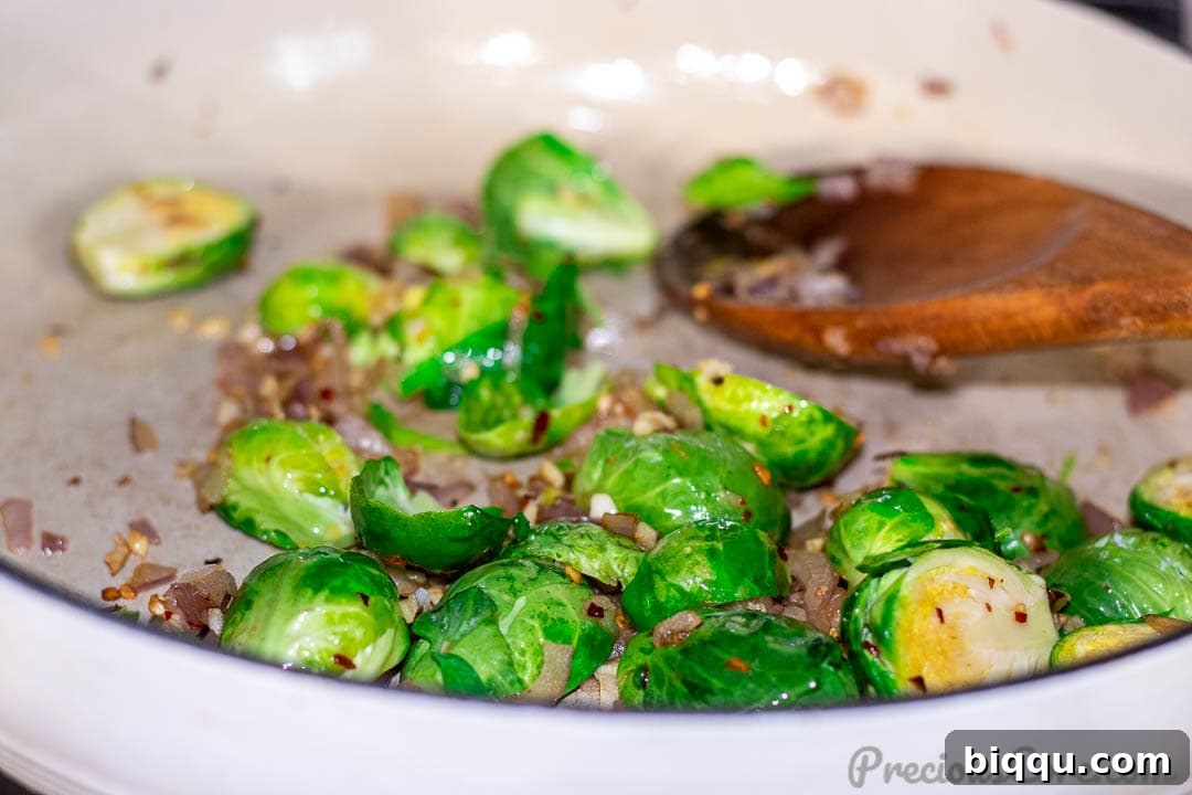 Vibrant Veggie Sauté 6 Brussels sprouts being added to the hot pan, marking the beginning of the vegetable sautéing process