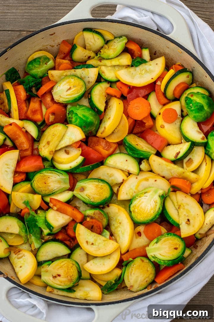 Vibrant Veggie Sauté 9 A large pot filled with a vibrant mixture of sautéed vegetables, ready to be served