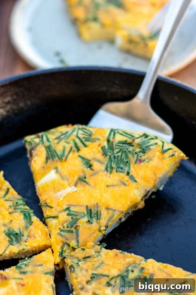Several inviting slices of homemade Potato Frittata arranged artfully, highlighting the texture of the potatoes and eggs.