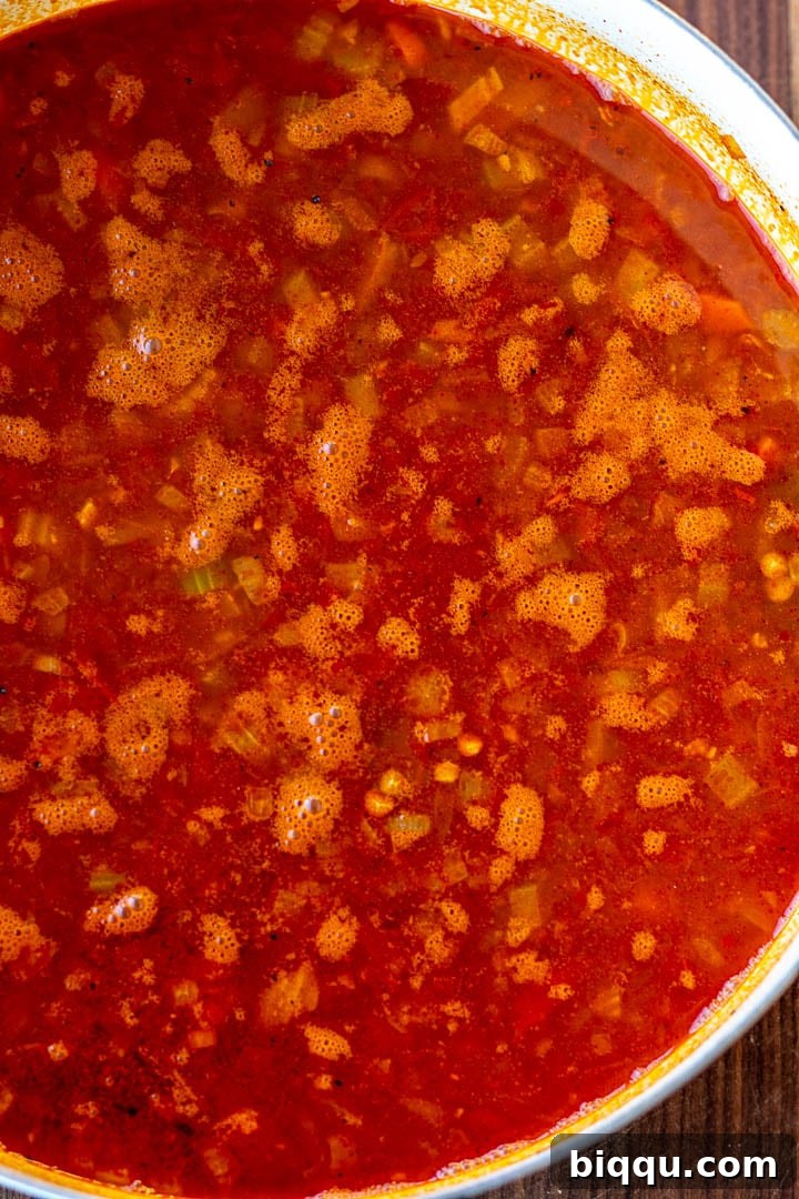 All the ingredients for Lentil Stew gathered in a large pot, ready to simmer and meld into a rich dish.