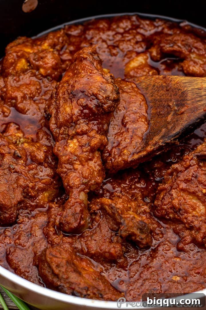 Red tomato chicken stew, a classic African dinner recipe.