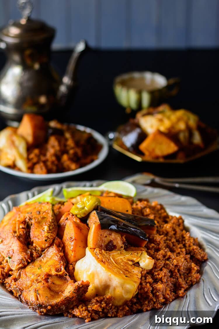 Senegalese dinner on serving platter: rice, fish and vegetables. The traditional Thieboudienne dish.