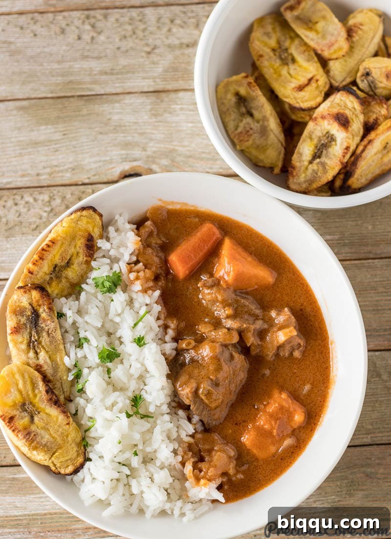 African Peanut Butter Stew served with rice and plantains. An easy and popular African Dinner recipe.