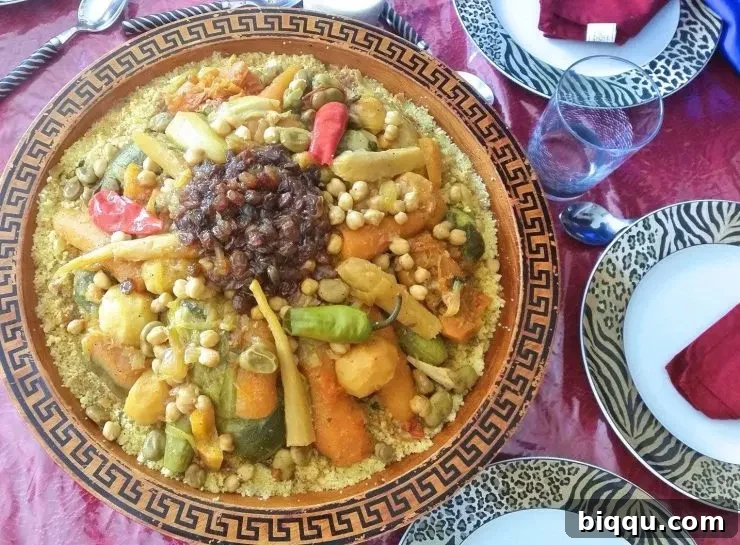 Moroccan Couscous in a dish with seven vegetables, a classic North African dinner.