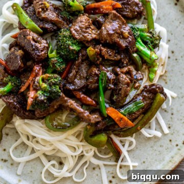 Beef stir fry over noodles