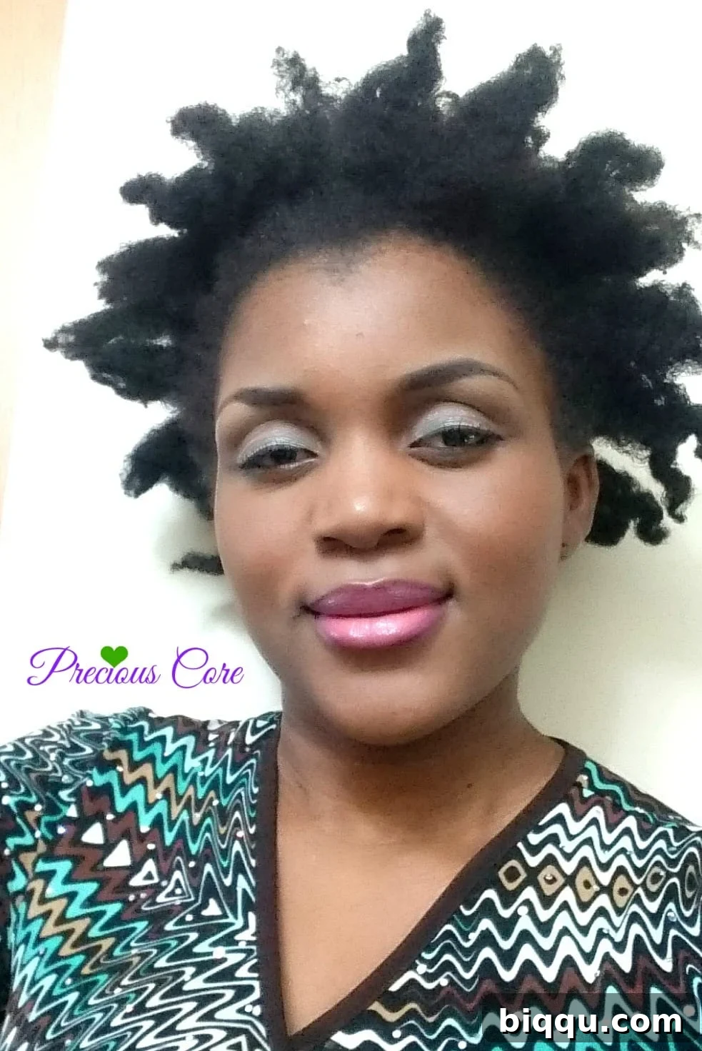 Author showcasing her bantu knot out natural hairstyle