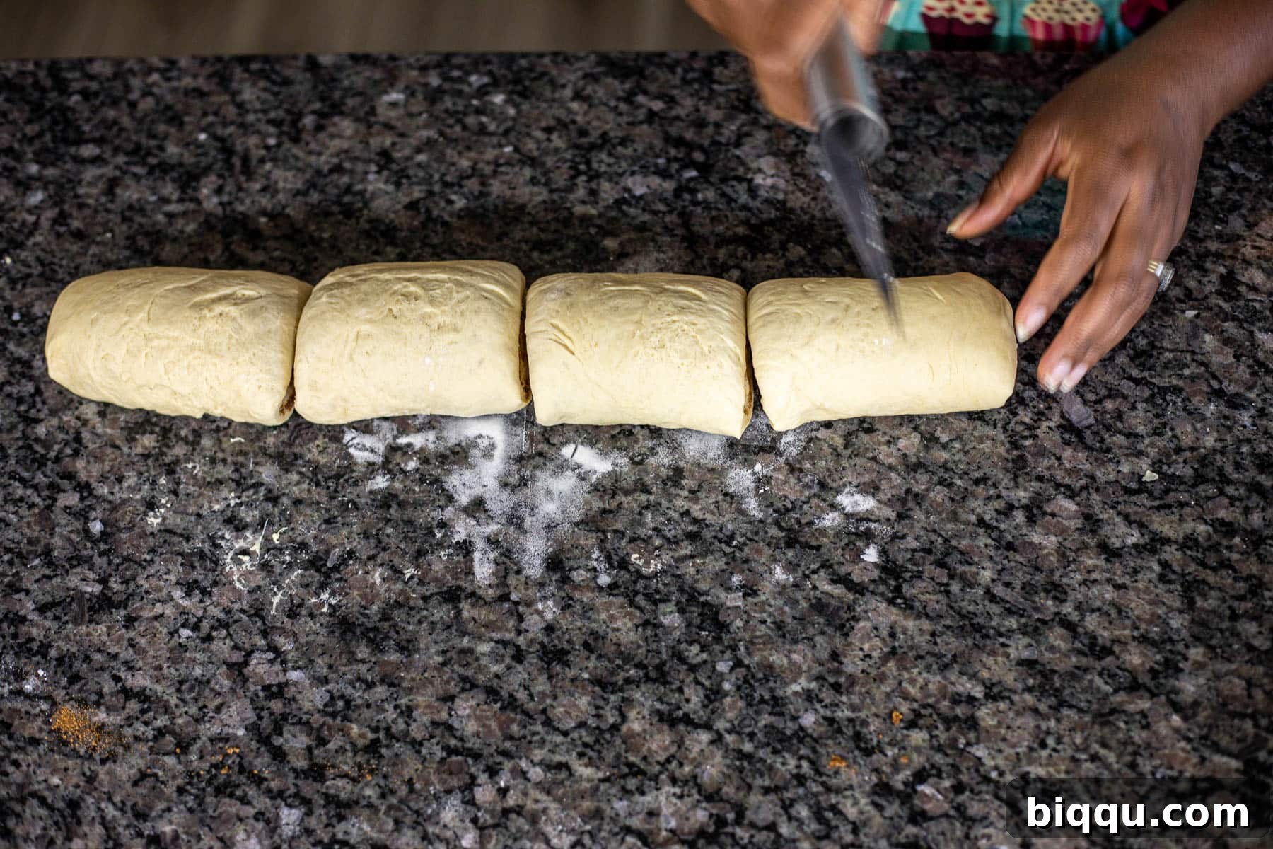 Cinnamon roll log cut into 4 pieces.