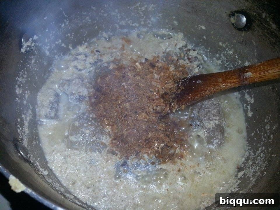 Crayfish added to the simmering egusi soup