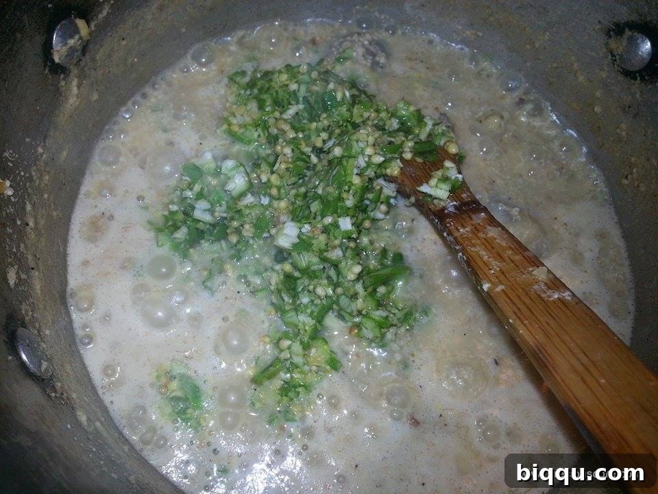 Freshly chopped okra added to the soup