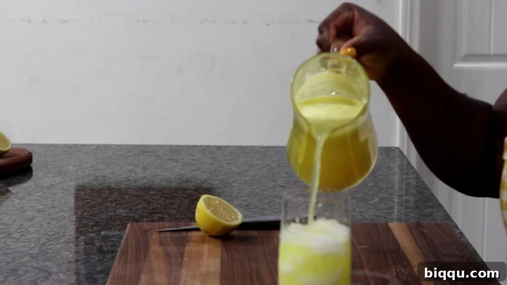 Pouring drink over ice
