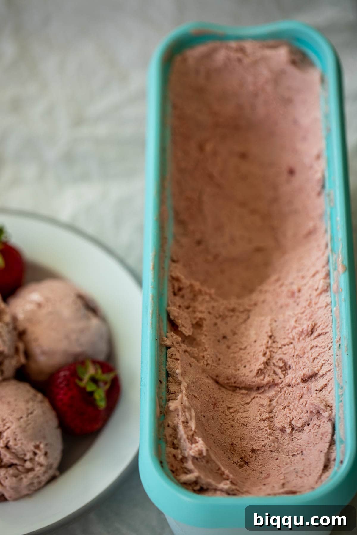 Creamy No-Churn Strawberry Dream 3 A large bowl filled with irresistibly creamy strawberry ice cream, showcasing its smooth texture and rich color.