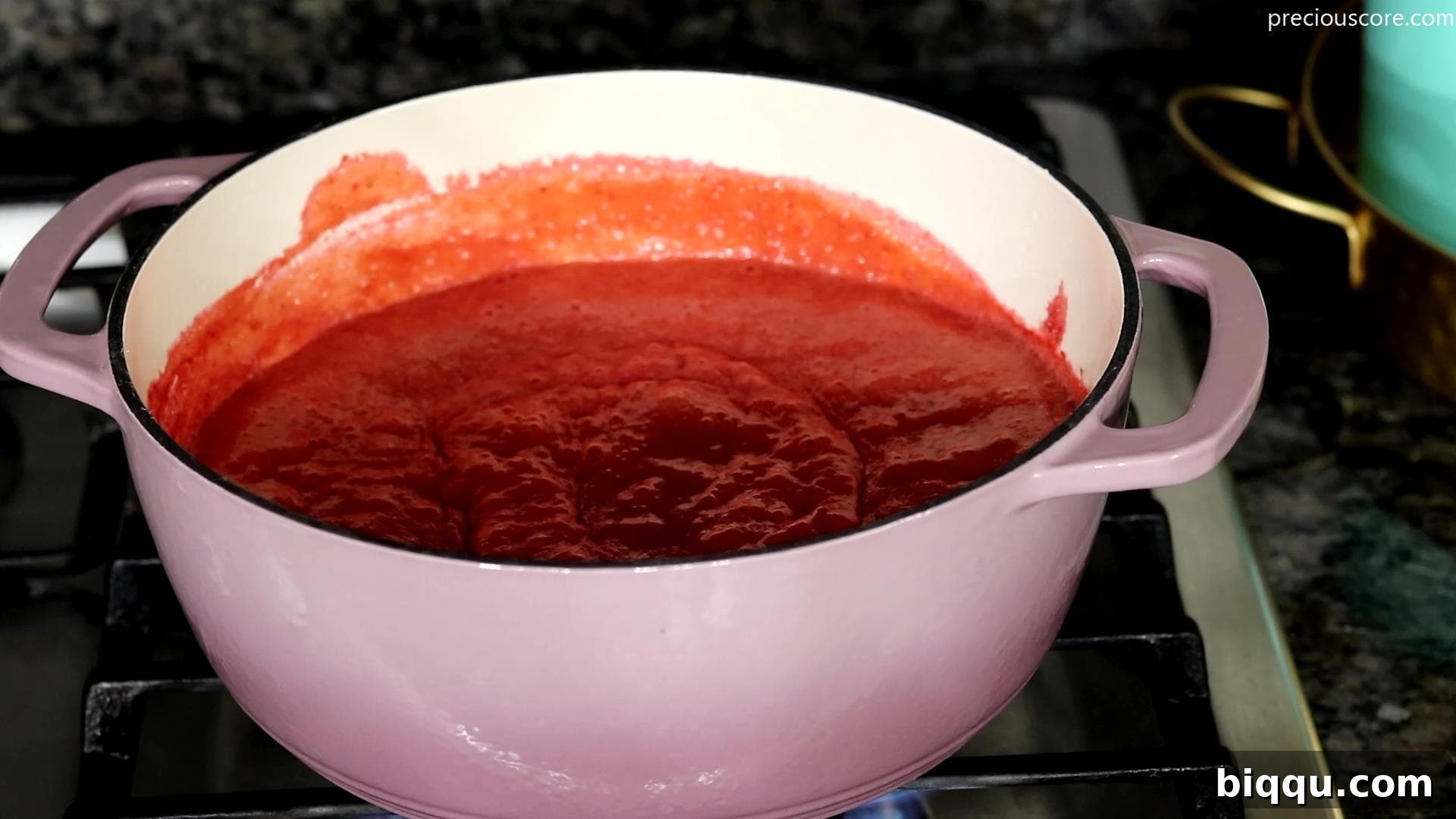 Creamy No-Churn Strawberry Dream 5 A pot simmering with a vibrant strawberry reduction, thickened and ready to cool.