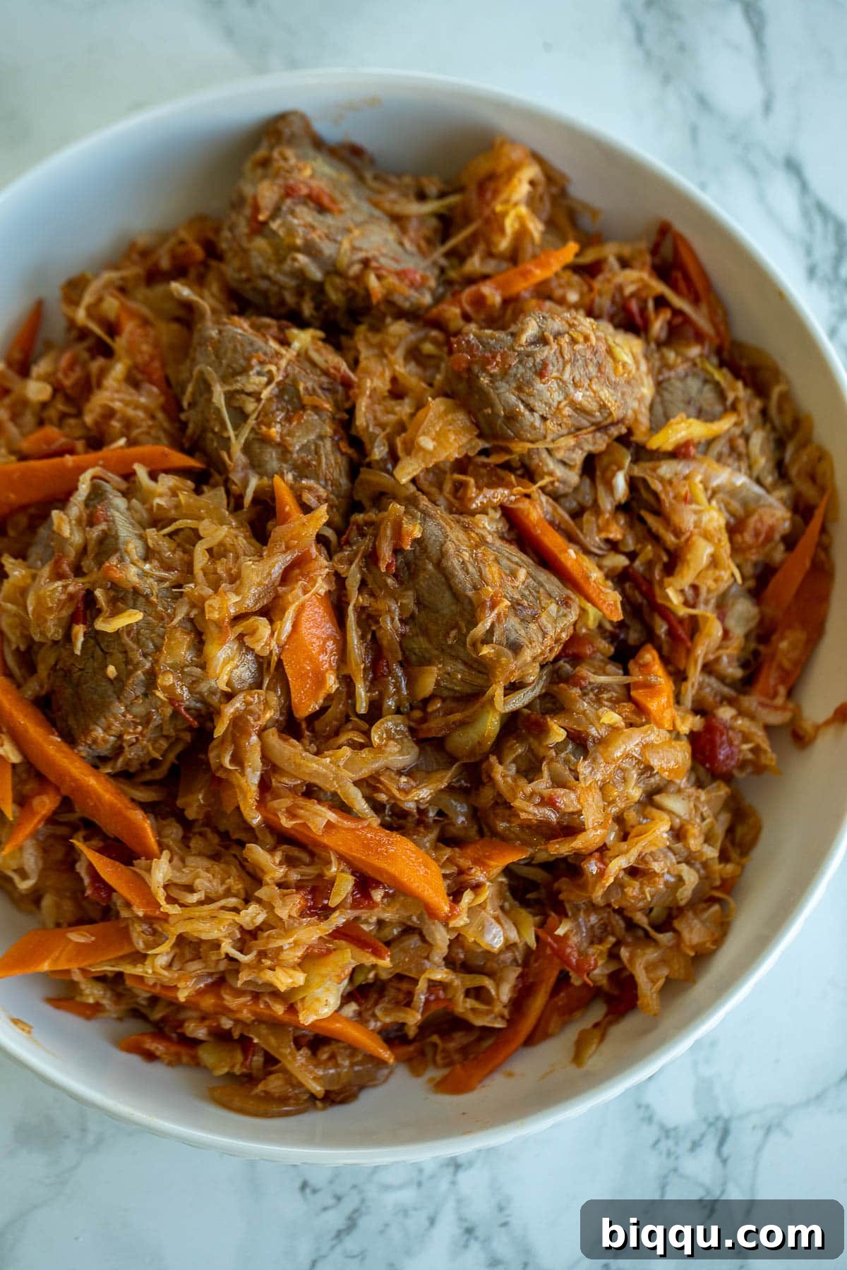 A vibrant bowl of Cabbage and Beef Stew, showcasing tender beef, vibrant cabbage, and a rich sauce, ready to be enjoyed.