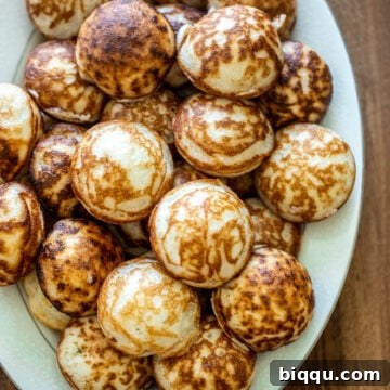 Tray of golden-brown Vitumbua