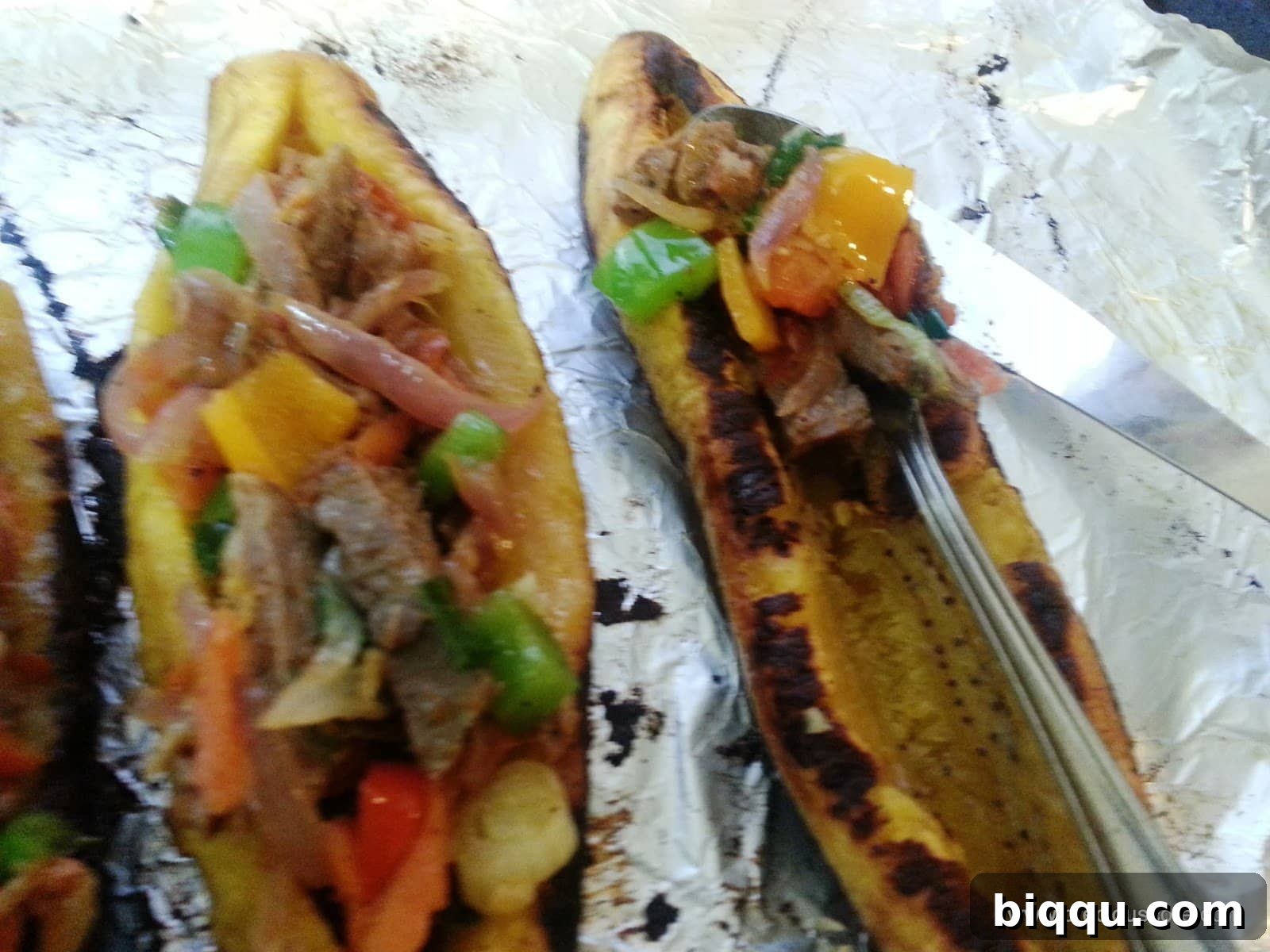 Plantain boats being stuffed with savory filling
