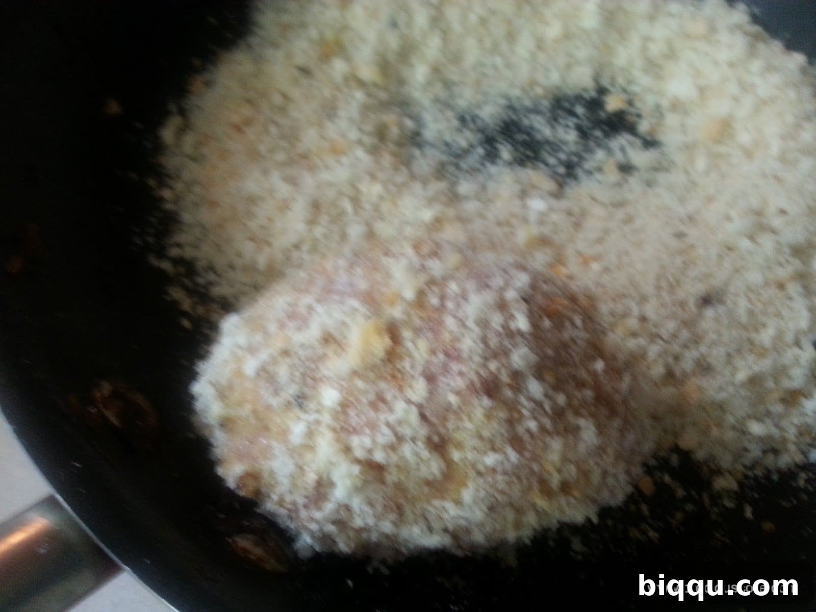 A tray of beautifully coated Scotch Eggs, meticulously prepared and lined up for deep frying.