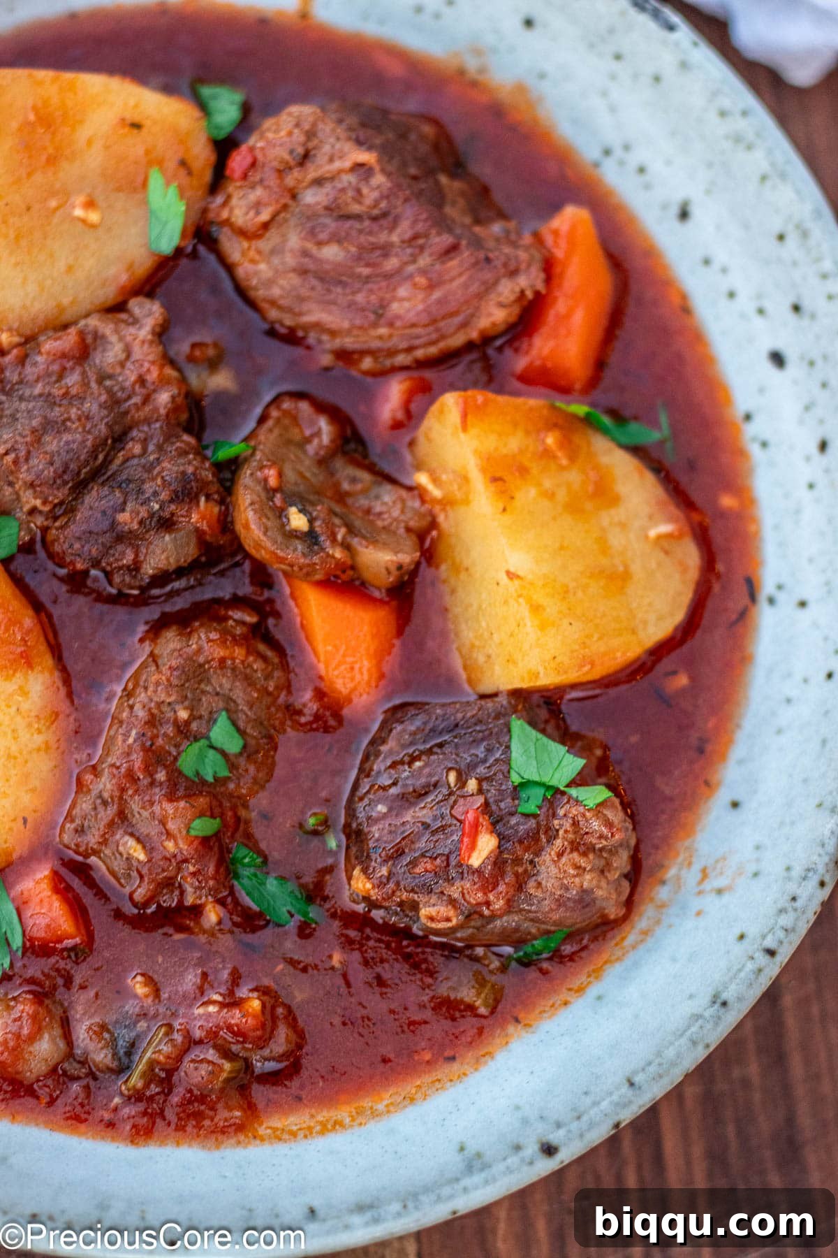 Hearty Beef Stew 3 Side shot of beef stew without wine in a bowl, highlighting its rich color and inviting texture.
