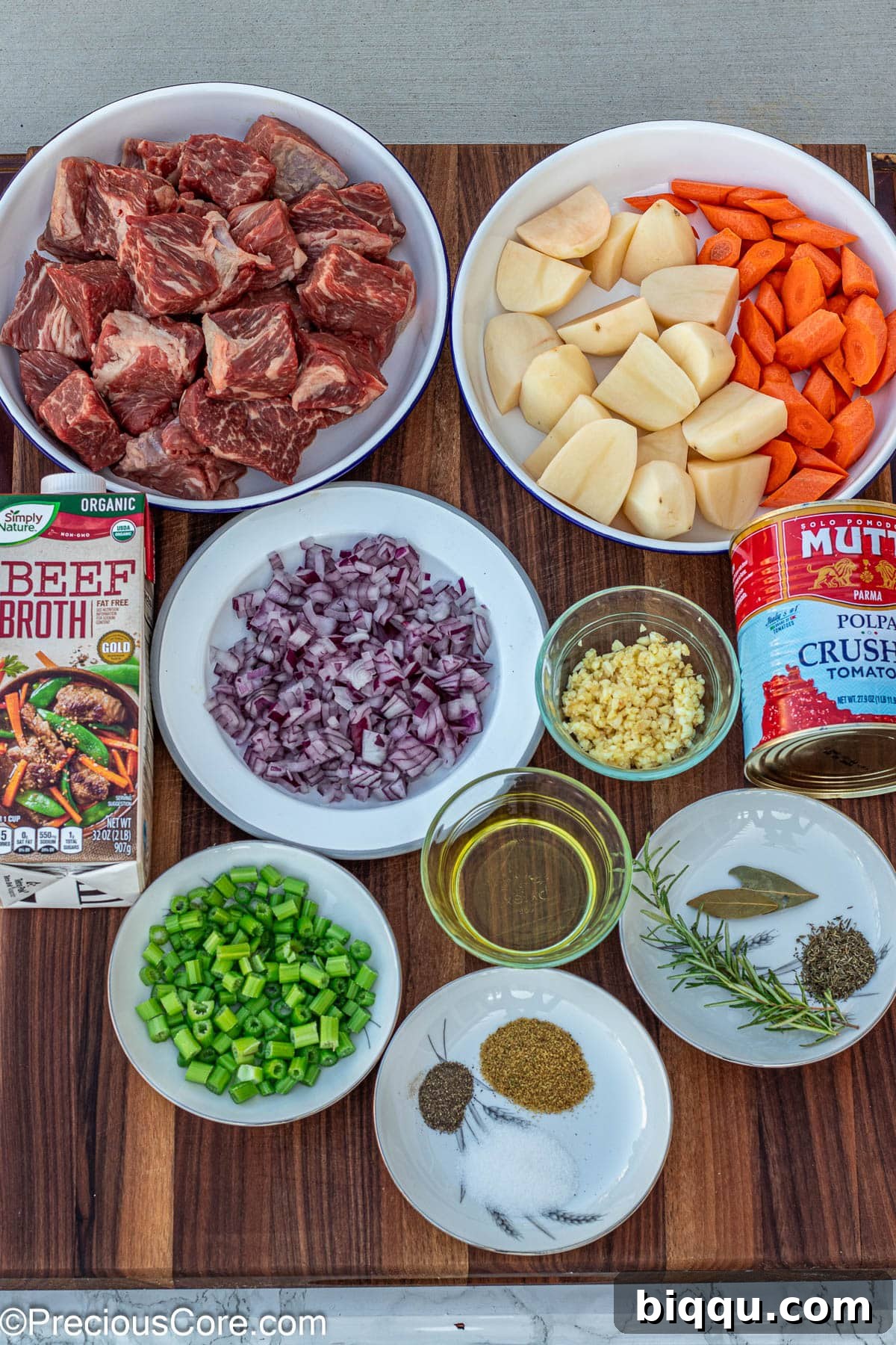 Hearty Beef Stew 5 Ingredients for beef stew without wine or flour laid out on a kitchen counter.