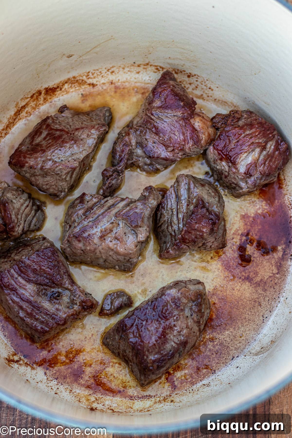 Hearty Beef Stew 7 Beef browning in a Dutch oven, creating a delicious crust.
