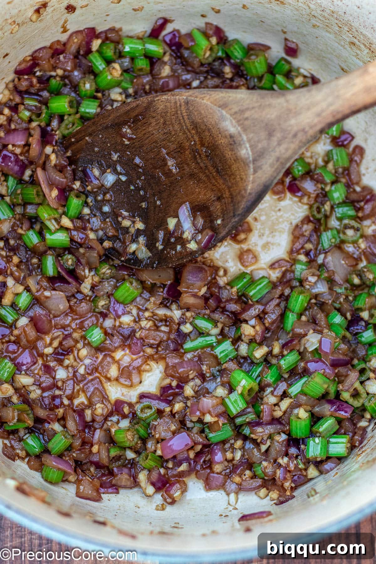 Hearty Beef Stew 8 Onions and celery cooking in a Dutch oven, softening and building flavor.