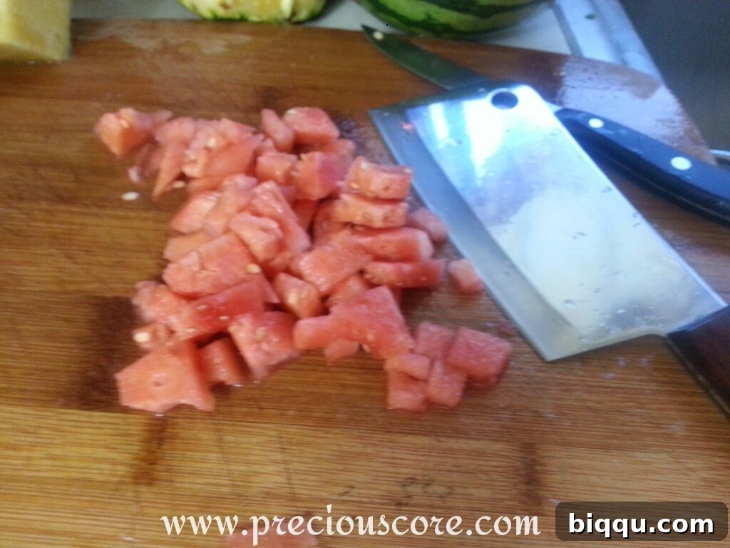 Chopped watermelon added to other fruits