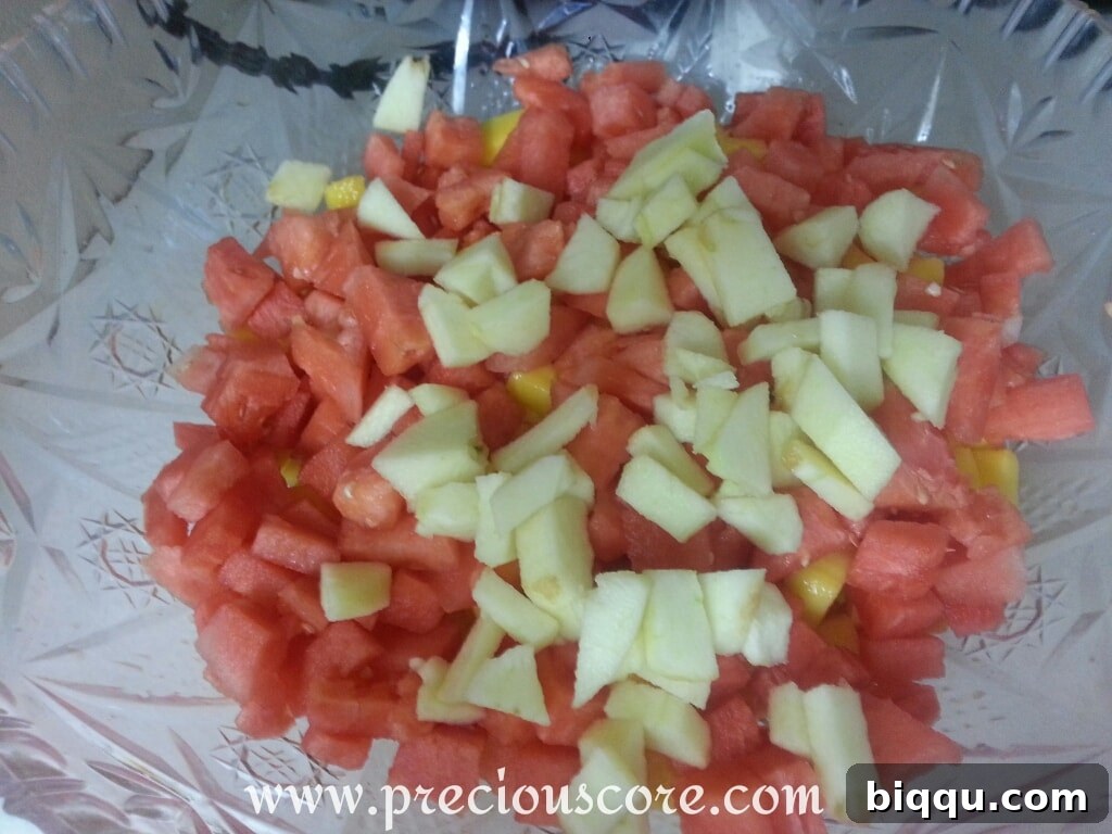 All chopped fruits combined in a large bowl