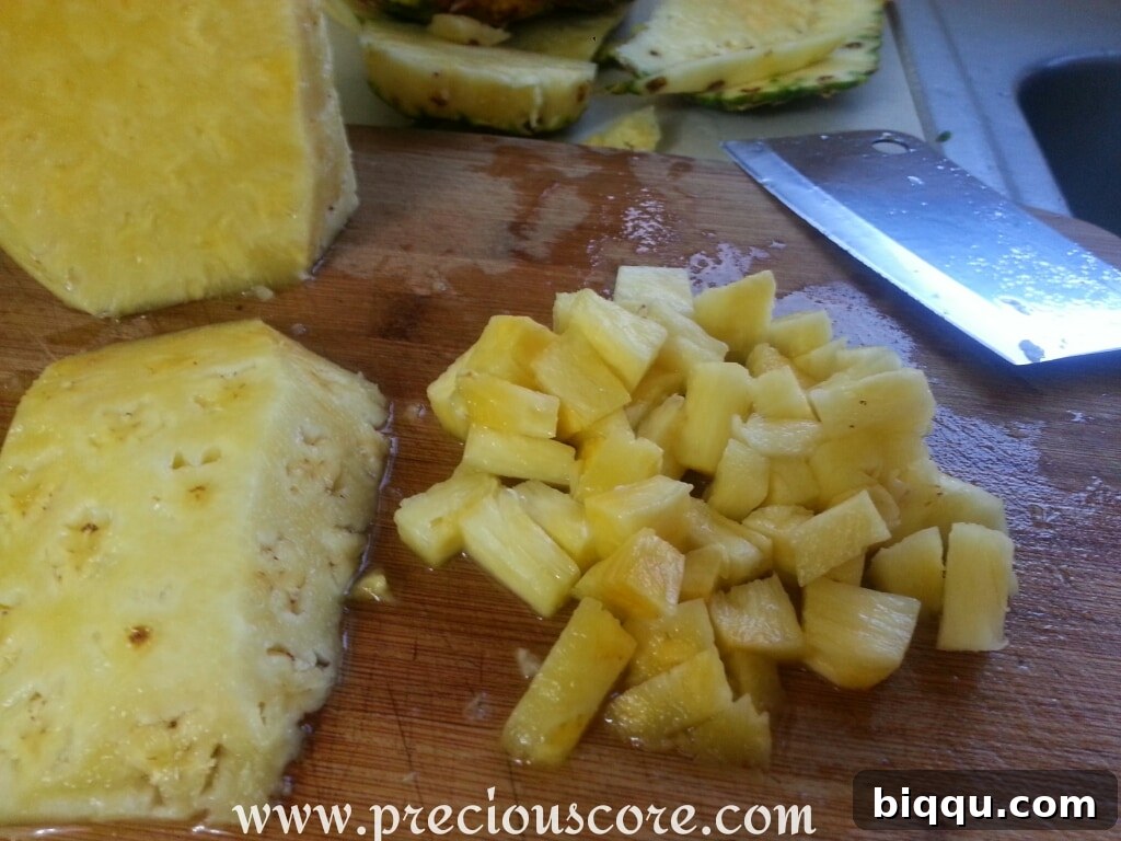 Chopped pineapple pieces ready for fruit salad