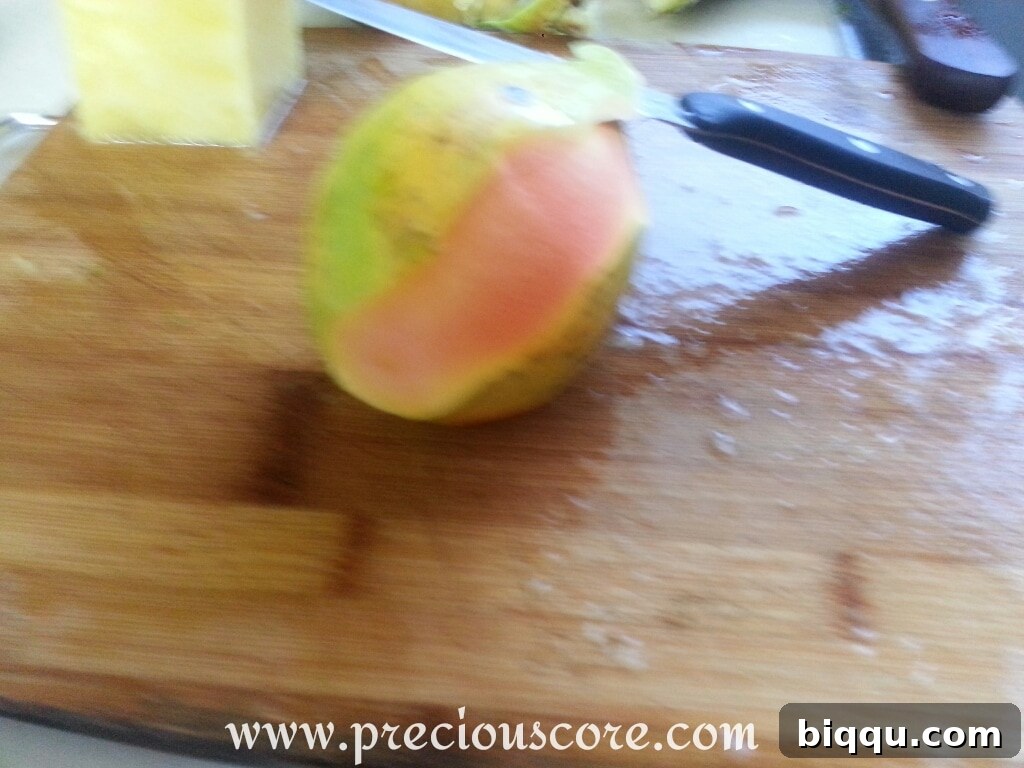 Peeled papaya ready to be cut