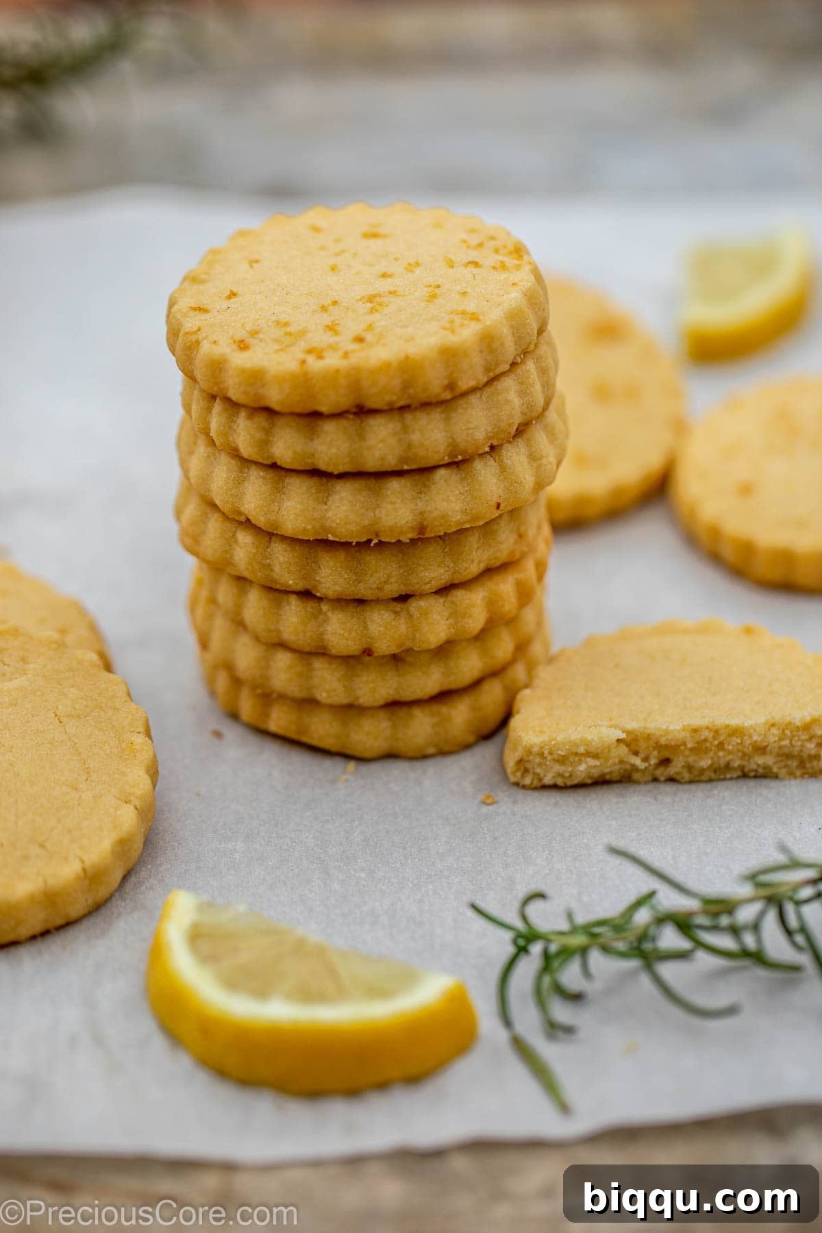 A stack of golden lemon shortbread cookies, perfectly baked and ready to enjoy.