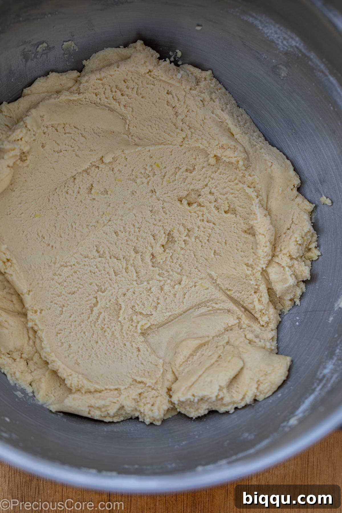 Shortbread cookie dough, perfectly mixed, resting in a large bowl.