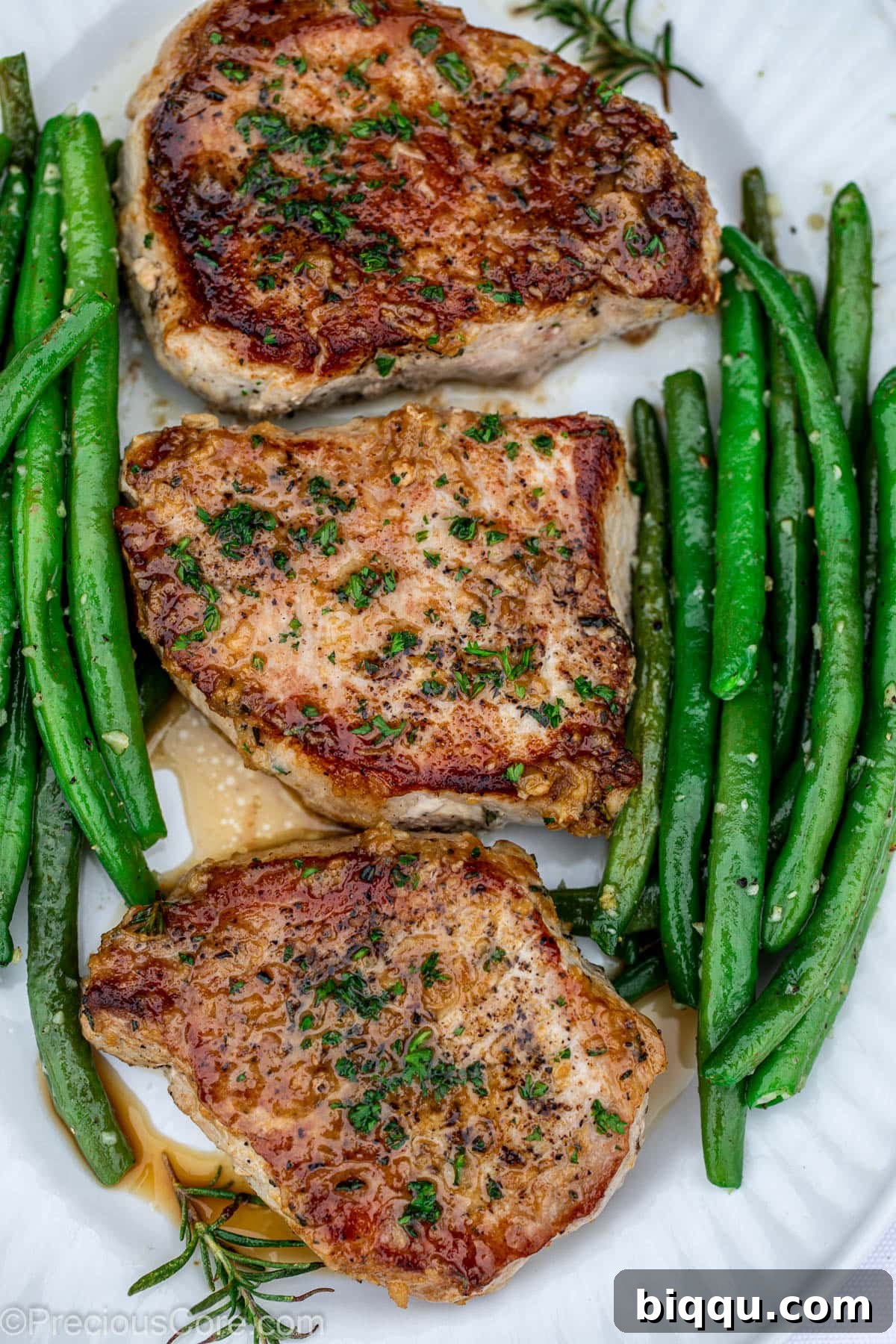 Pork Chops in a pan with green beans.
