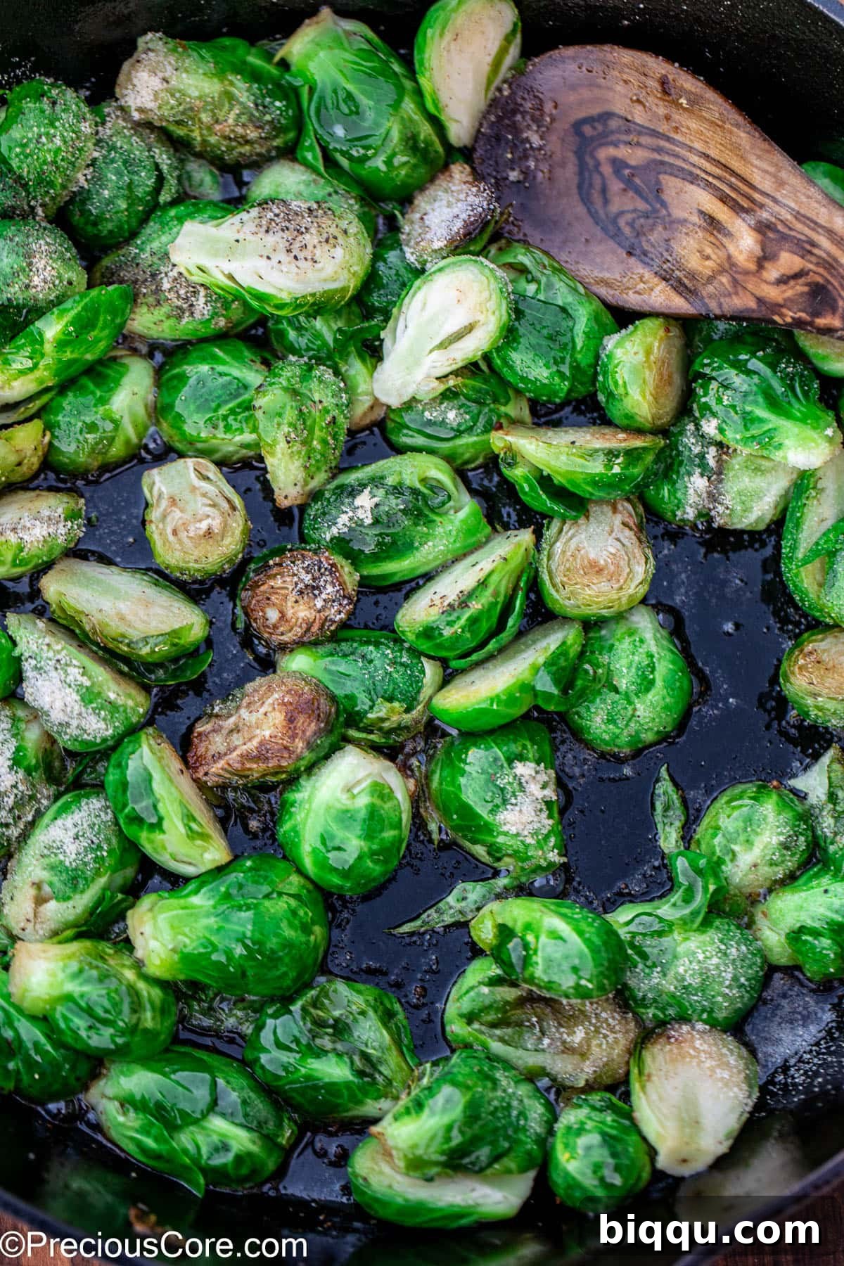 Bright green Brussels sprouts sprinkled with salt and pepper.